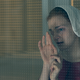 Janine (Madeline Brewer) watches her child.